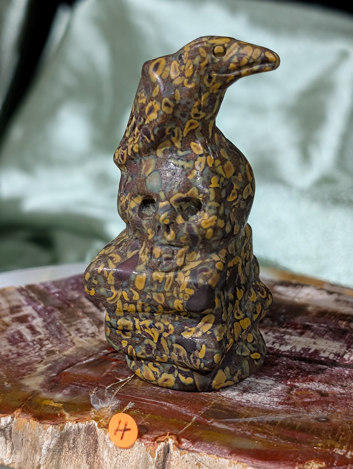 Fruit Jasper Raven on Skull on Books Figurine