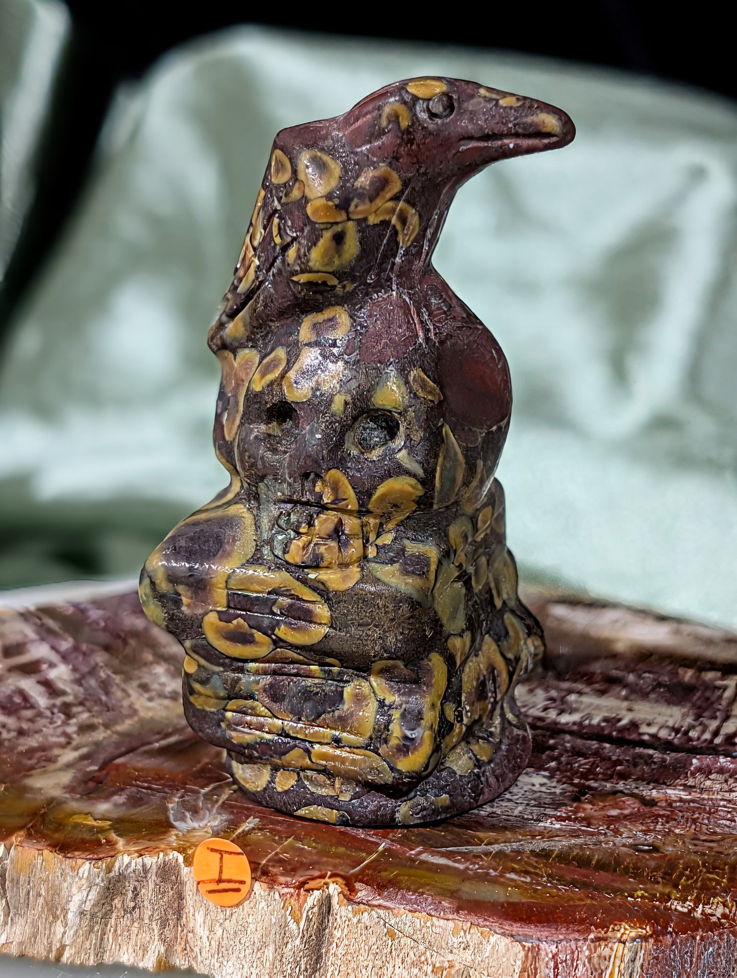 Fruit Jasper Raven on Skull on Books Figurine