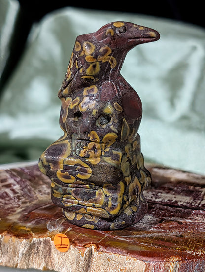 Fruit Jasper Raven on Skull on Books Figurine