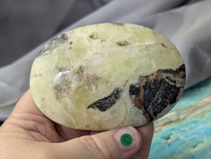 Yellow Brucite Palm Stone