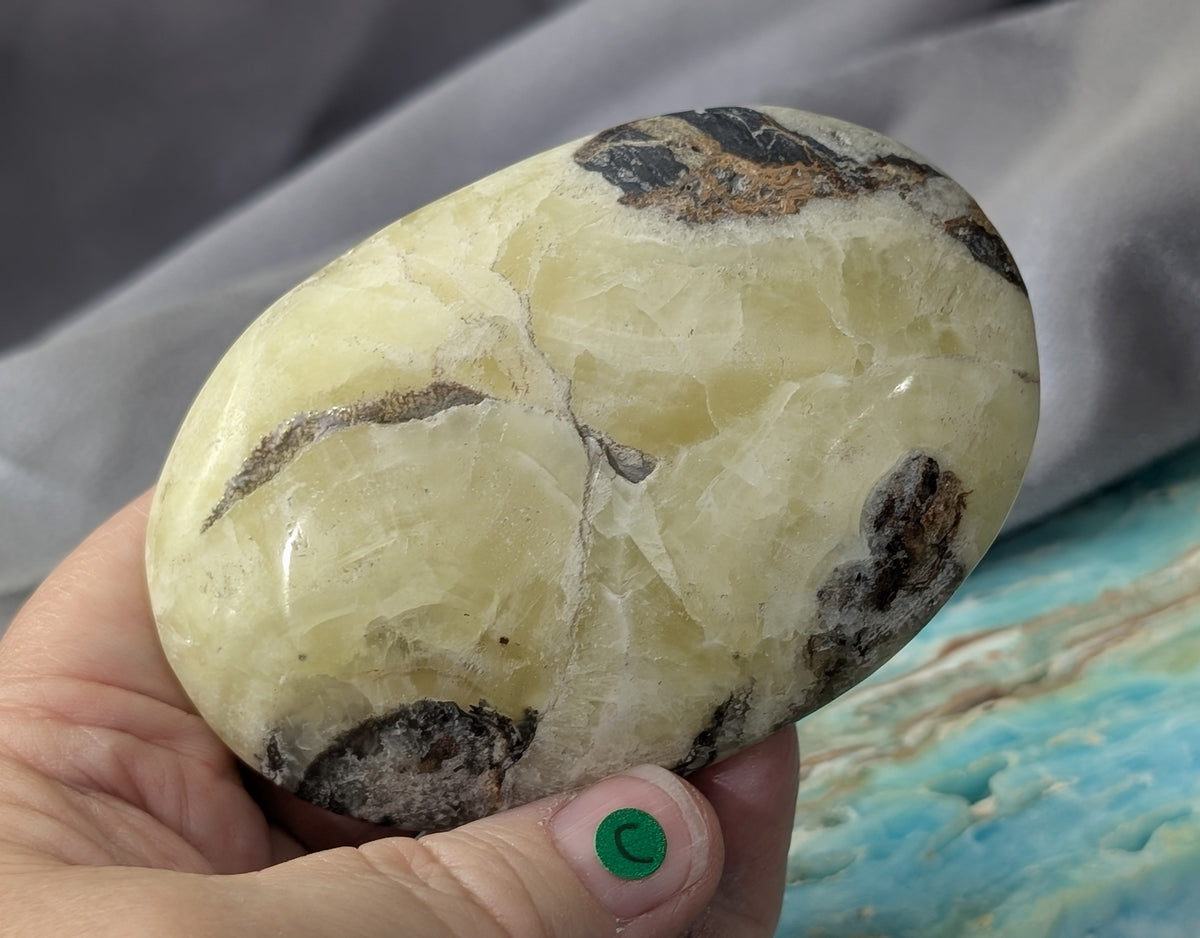 Yellow Brucite Palm Stone