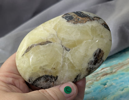 Yellow Brucite Palm Stone