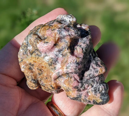 Rhodonite Skull and Snakes Carving